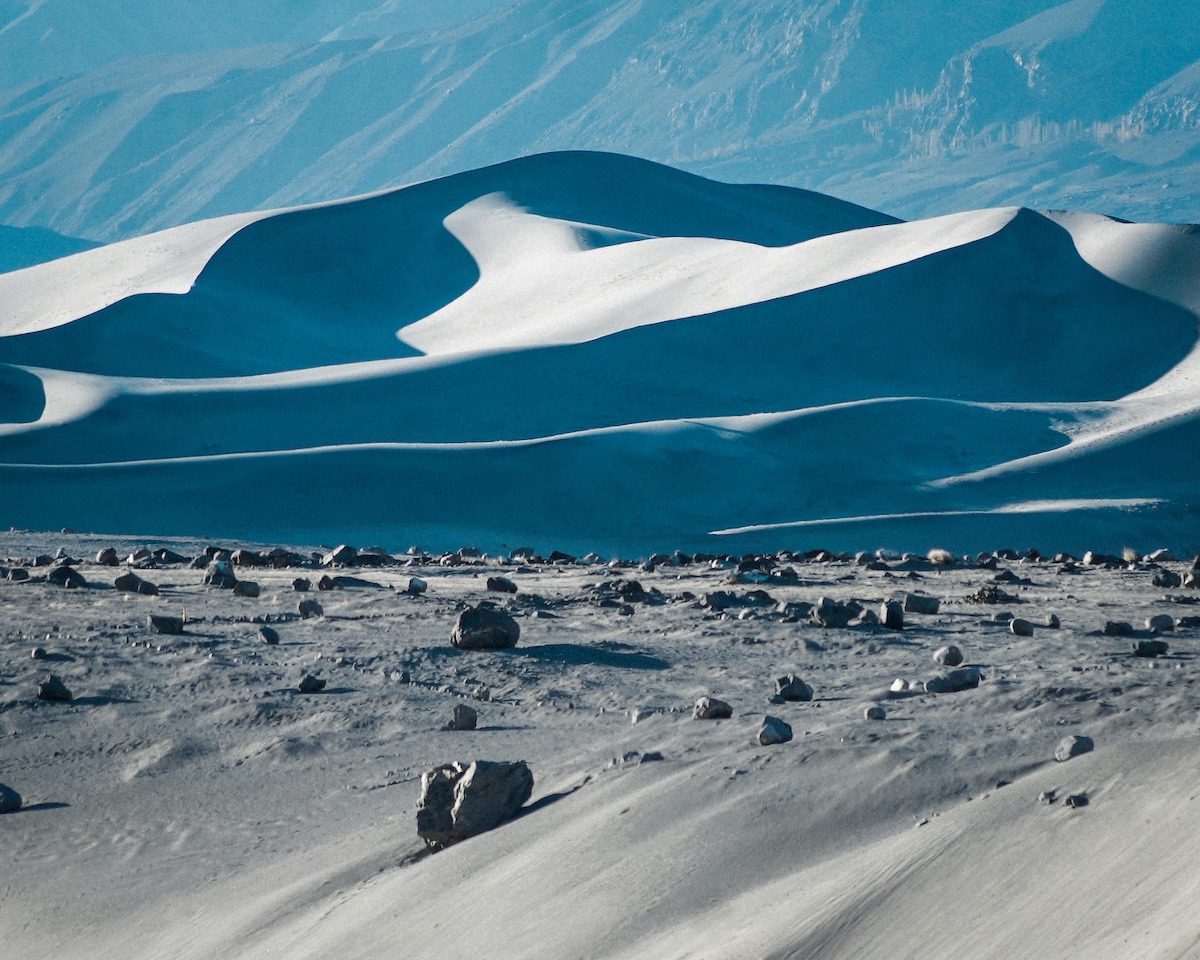 remote desert landscape with dunes in the background