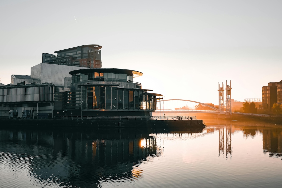 MediaCityUK building at sunset on the river at Salford Quays